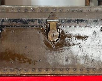 1913 " Estate Of James S. Topham" Steamer Trunk
This could very well be a true steamer trunk because true steamers had to fit under the bunk of 18 inches. If you want to look up James S. Topham, you may find out that he was a trunk maker. For what it’s worth, you can see that this trunk says that it is the Estate of James S. Topham. I have not found any other Brass plaques with Estate written on it as well as the date and number of the trunk. It dates back to June 20, 1913. The specifications number looks to be 1167. It also has a brass Eagle lock from Terryville, Conn.

*Please note we can ship this item although it is marked pickup only, just know there will be additional costs.

31L x 17D x 14H