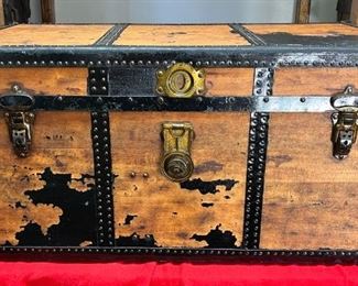 Steamer Trunk Featuring J. H Sessions #2 Latches
This could have been a true steamer trunk because they had to slide under the 18-inch births.  

It has J. H Sessions #2 latches and a very nice brass lock. 

*Please note we can ship this item although it is marked pickup only, just know there will be additional costs.

30L x 19D x 22L