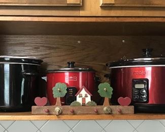 Various sized crock pots