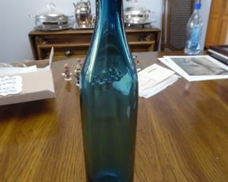 Tall slender blue glass piece