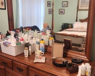 toiletries and dresser with mirror