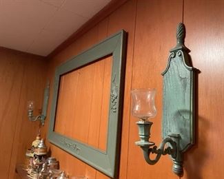 Three-piece frame and sconce set.