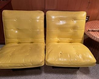 Pair of mid-century modern yellow tufted Naugahyde chairs. Also a matching black one.