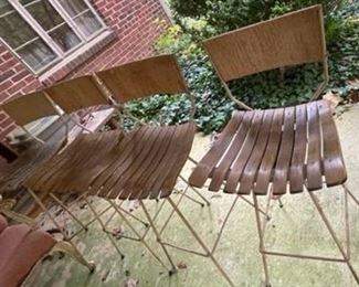 Four mid-century modern hairpin leg stools.