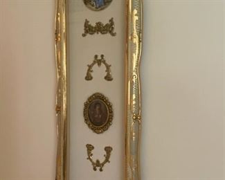 Medallions in gold gilt wood frame.