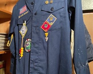 Cub Scout shirt with badges.