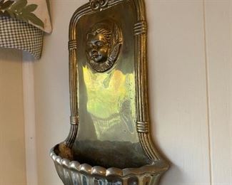 Small solid brass cherub wall pocket.