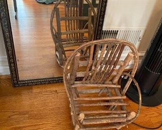 Child's rocker and large mirror.