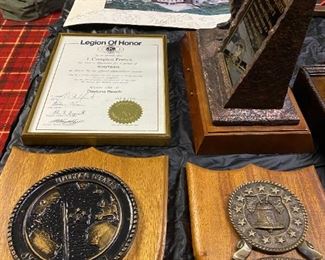 Assorted military plaques.