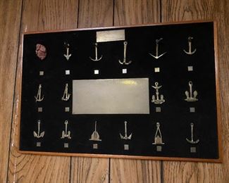 Display of anchors presented to Navy Captain.