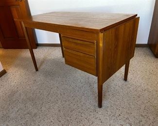 Danish Modern Teak Desk G.V. Gasvig Desk	Table top dimensions without Leaf 48 in x 24 in. With Leaf 64 in x 24 in desk, height, 28.25 inches, 49.25 inches long 24.25 inches deep.	
