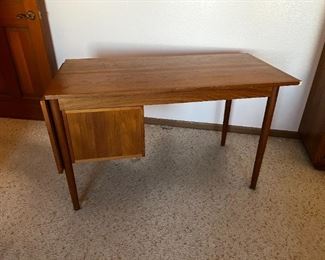 Danish Modern Teak Desk G.V. Gasvig Desk	Table top dimensions without Leaf 48 in x 24 in. With Leaf 64 in x 24 in desk, height, 28.25 inches, 49.25 inches long 24.25 inches deep.	

