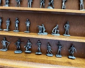 Franklin Mint Fighting Men of America Pewter Figurines w/ wooden wall display Lot of 50	Average figure height 2 inches 50 figures wooden shelf measurements 15 in x 20 in	
