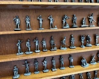 Franklin Mint Fighting Men of America Pewter Figurines w/ wooden wall display Lot of 50	Average figure height 2 inches 50 figures wooden shelf measurements 15 in x 20 in	

