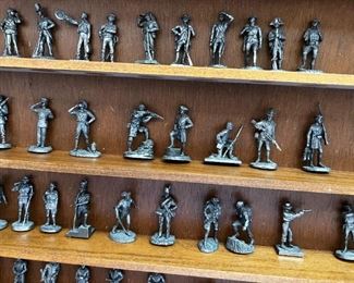Franklin Mint Fighting Men of America Pewter Figurines w/ wooden wall display Lot of 50	Average figure height 2 inches 50 figures wooden shelf measurements 15 in x 20 in	
