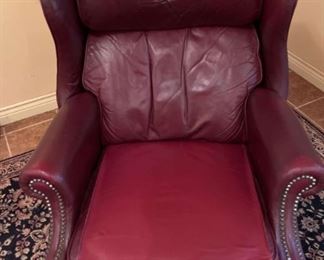 Burgundy Leather Reclining Armchair
Red leather wing back chair,38hx29wx32 deep. Reclines to a full laid back position. Needs some minor cosmetic repairs.