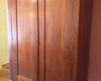 Large Antique Wardrobe
Beautiful large wardrobe. Size shelves on the left and right.  Right side originally may originally have been configured for hanging clothes.
Overall dimensions 85"H x 54"W x 19"D
Left shelving 22"W
Right shelving 29.5"W