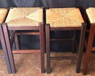 Barstools with Wood Frame and Rush Seats
4 counter height-24", bar stools. Wood frame stained dark brown with foot rest. Seats are rush. All 4 are in very good condition. H-24", seats are 131/2" square.