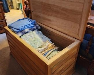 handmade trunk full of sheets