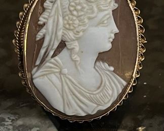 An 1840s framed shell cameo with stand