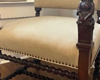 Stunning English barley twist chair with carved maiden relief on arms.  Recently upholstered in ecru linen