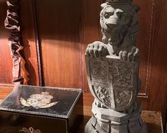 The Fireside Lion… A crowned lion—the symbol of England—holds the Royal Coat of Arms 