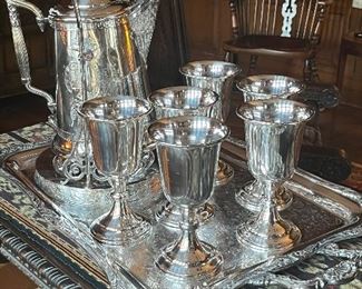 Hand chased deep silver cold water urn and six English goblets 