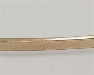 VINTAGE 10K HOLLOW GOLD BAR PIN. 2" LONG. MARKED 10 ON REVERSE. SOME DENTS. 2.5 GRAMS