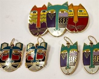 LAUREL BURCH ENAMELED PIN AND EARRINGS: 2 5/8" WIDE PIN TITLED "NATIVE CATS". TWO PAIRS OF EARRINGS TITLED "MIIKIO AND NATIVE CATS" 