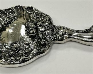 ART NOUVEAU QUADRUPLE PLATE HAND MIRROR WITH BEVELED GLASS . 10" LONG. MONOGRAMMED. AGE RELATED WEAR ON GLASS AND BACKING 