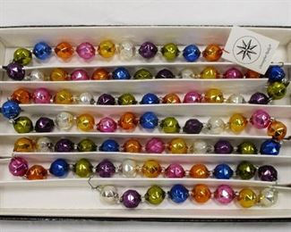 CHRISTOPHER RADKO "JEWEL TONES " BLOWN GLASS GARLAND. 1993. MADE IN CZECH REPUBLIC. 6" LONG. HAS BOX AND TAG 