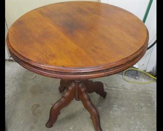 ROUND SIDE TABLE. EASTLAKE STYLE LEGS, SOLID WOOD TOP. 29" TALL, 30" DIAMETER. c1900. Condition: two bolts replaced on the under side. Some paint marks 