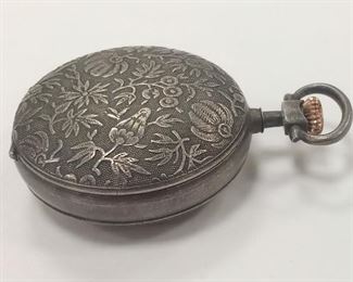 POCKET WATCH STYLE AND SIZE POWDER COMPACT. 1 1/8". HAS COTTON PUFF WITH CELLULOID RING. SOME SILVERING MISSING FROM MIRROR 