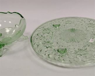 VASELINE OR URANIUM GLASS: SHAGGY DAISY THREE FOOTED CAKE PLATE AND A FOOTED BOWL. PLATE IS 10" ACROSS. Condition: the cake plate has rough spots on underside inside rim, some knife marks from use 
