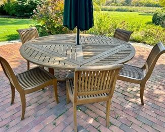 Beautiful Teak Dining Set - this table breaks down to a square table if you don't need the extra seating,  We also have a round umbrella tablecloth custom made for this table in green & white checked!