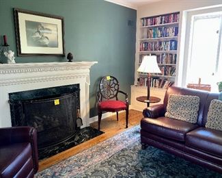 This is the library - there is a leather loveseat by Smith Brothers of Berne, IN, a Table Floor lamp, art, a leather recliner, fab rug, arm chair and more.  Did we mention BOOKS?  There are four shelves like the one shown packed with amazing books of all genres.