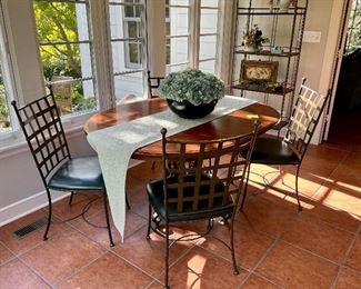 This is an amazing dinette set with an etagere in the background.  The Oval Table is Nichols & Stone and the 4 Chairs are Charleston Forge.