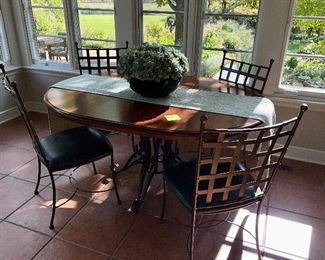 This is an amazing dinette set with an etagere in the background.  The Oval Table is Nichols & Stone and the 4 Chairs are Charleston Forge.