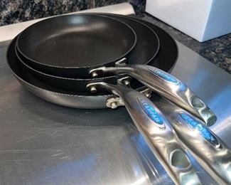 Three graduated sizes of skillets