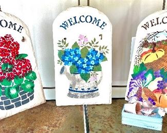 These welcome signs are actually quite heavy made of some. type of stone.  Cute.