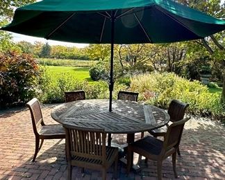 Beautiful Teak Dining Set - this table breaks down to a square table if you don't need the extra seating,  We also have a round umbrella tablecloth custom made for this table in green & white checked!