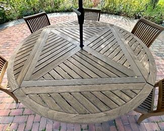 Beautiful Teak Dining Set - this table breaks down to a square table if you don't need the extra seating,  We also have a round umbrella tablecloth custom made for this table in green & white checked!