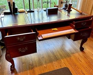 Hekman Executive Desk with Leather Inserts on the Top.  Left File Drawer, Center Keyboard Drawer and 2 Drawers on Right.  Ball and Claw Feet 