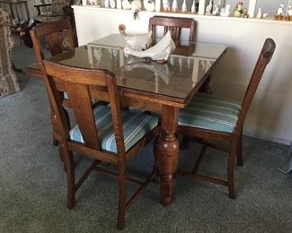 Beautiful, antique dining table and chairs and pull out extension leaves. 