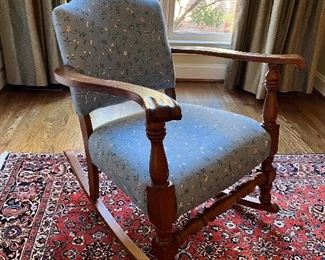 Antique upholstered rocking chair