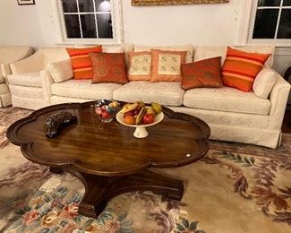 Lovely white cotton upholstered sofa with clover shaped coffee table