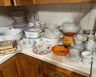 Vintage pyrex bowls, cups, pots, plates and other porcelain dishware