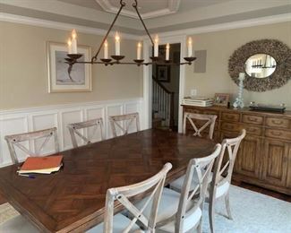 Fabulous Bausman dining table extends to accommodate a large group. Chandelier, chairs and mirror are also for sale