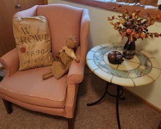 Beautiful Wing Back Chair, Wrought Iron and Stone Table, and Primitive Decor.
