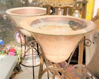 Pair of planters on iron stands